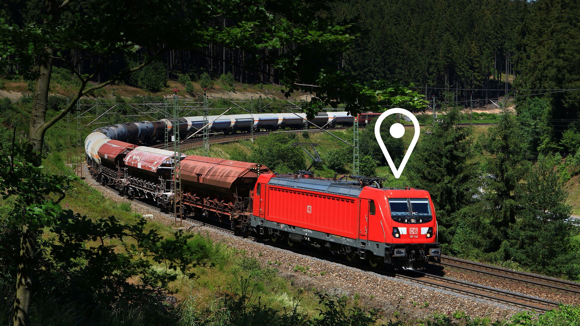 A freight train travelling through a landscape