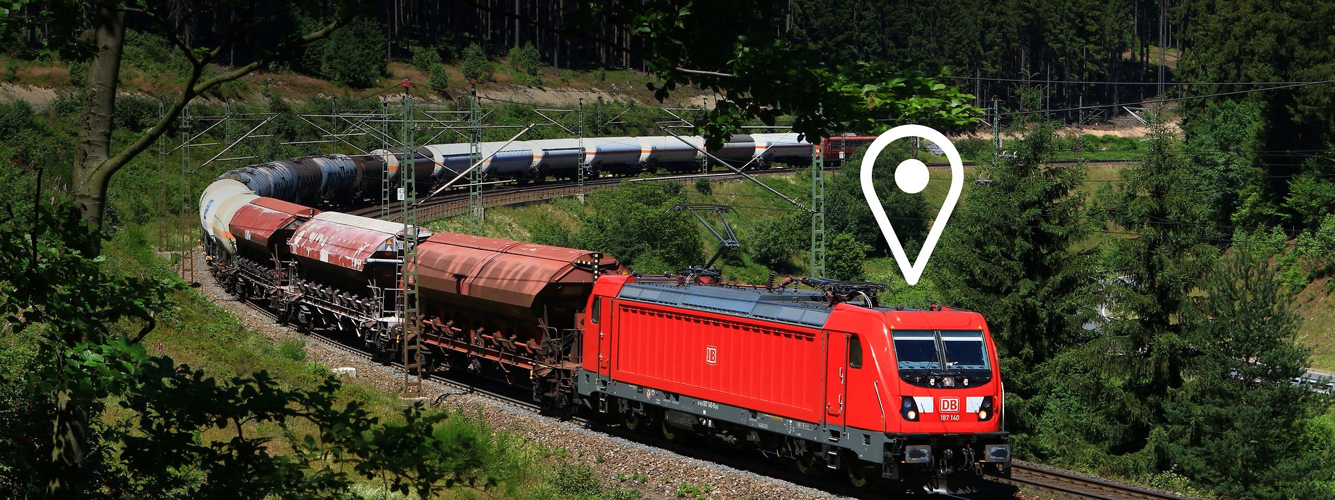 A freight train travelling through a landscape